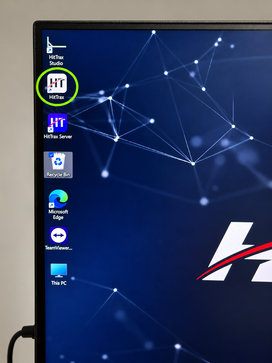 Desktop with the white HitTrax shortcut circled