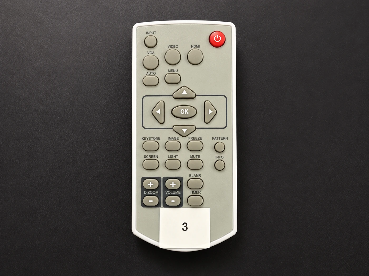 Projector remote labeled 3 with red power button